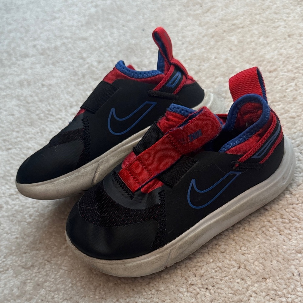 Nike Kids Black and Blue Sneakers with Red Accents